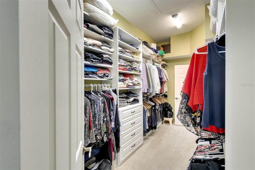 Large walkin custom closet.