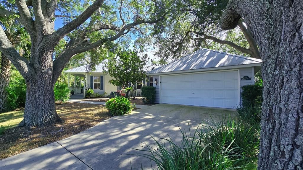 Situated on two lots, one of which is a corner nestled in perfectly planted trees.