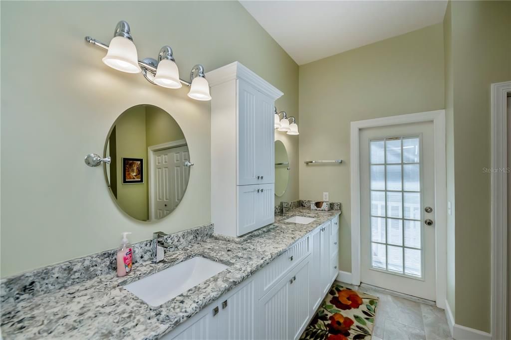 Remodeled ensuite bathroom with door to the lanai.