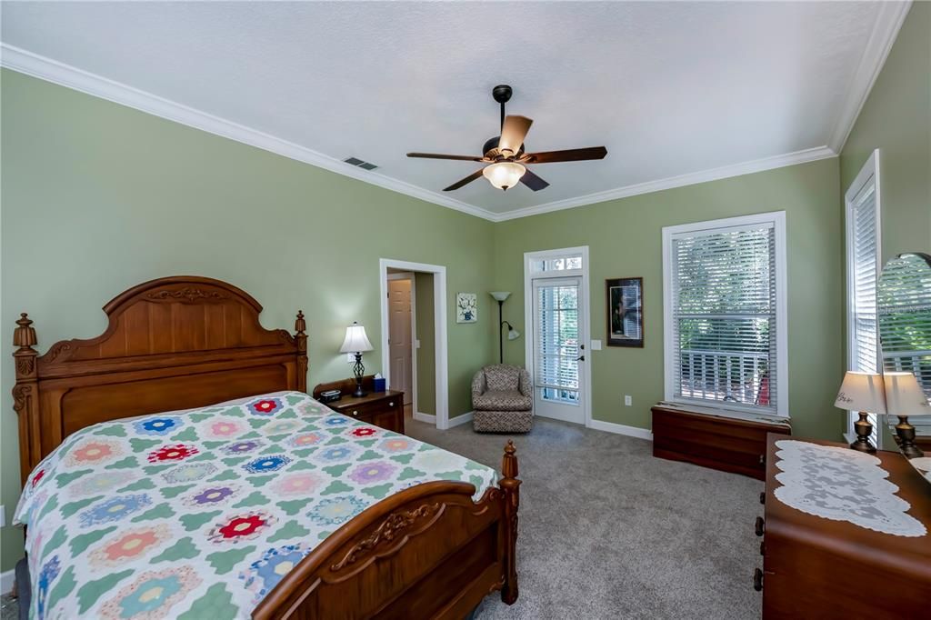 The primary bedroom opens to a private porch.