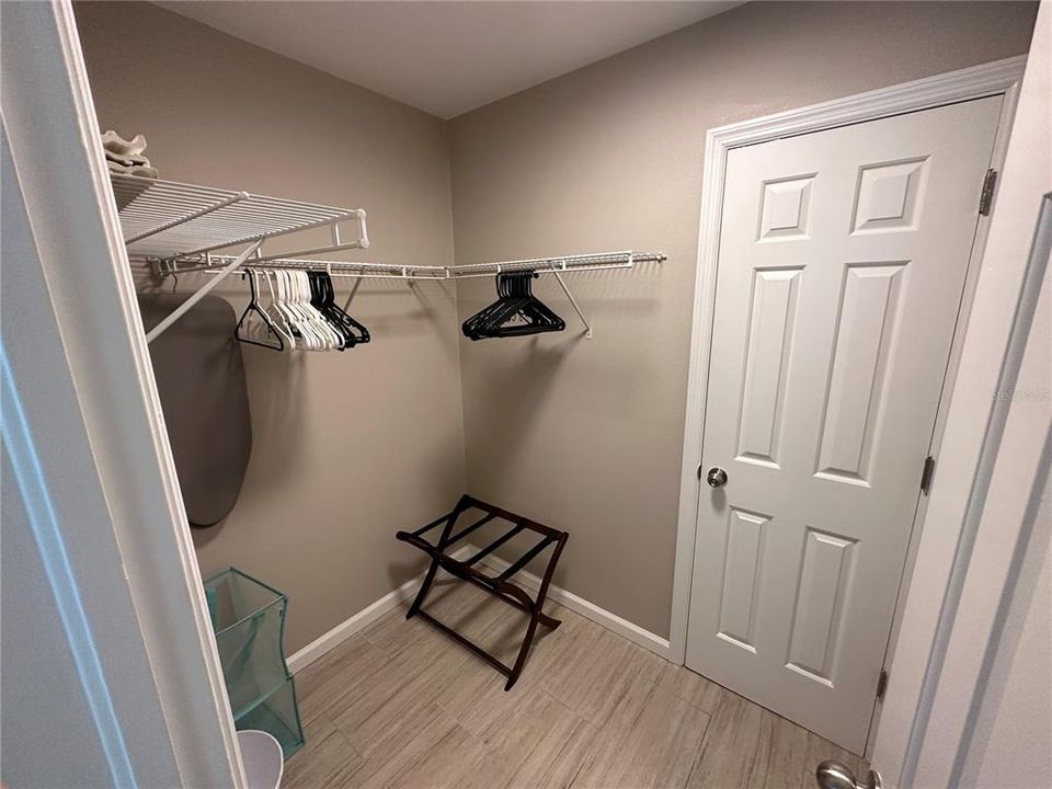 Spacious closet.  Door on the right is to to the bathroom.