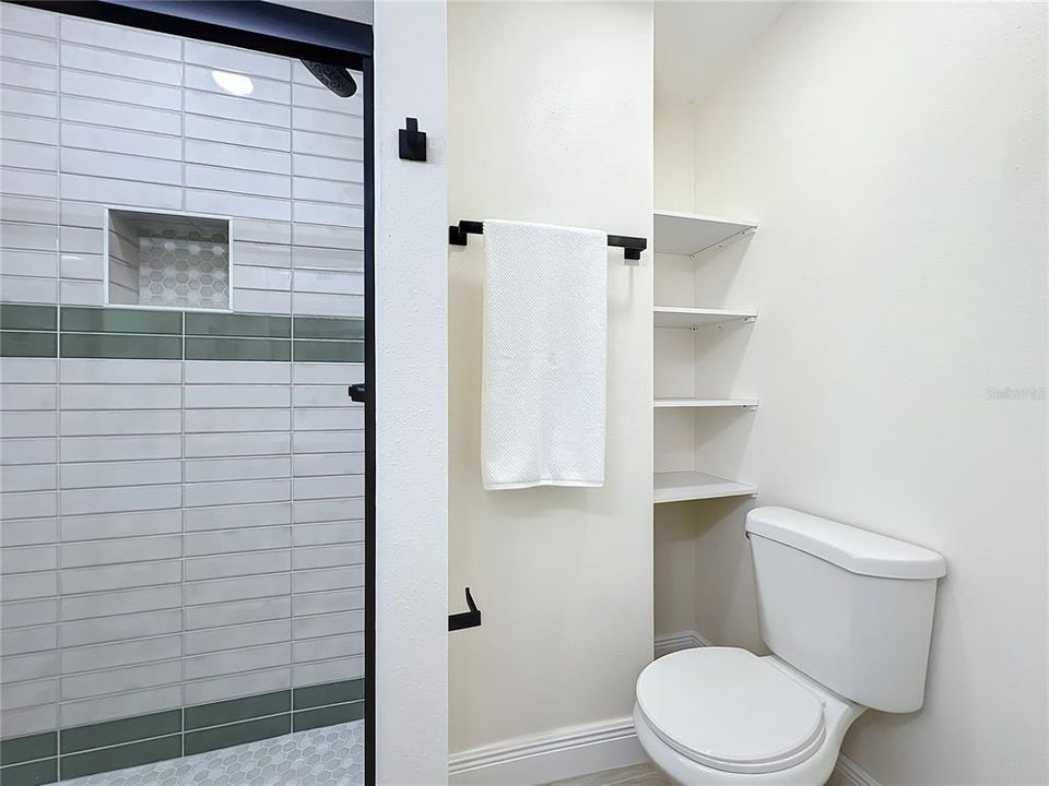 Guest bath with built-in shelving