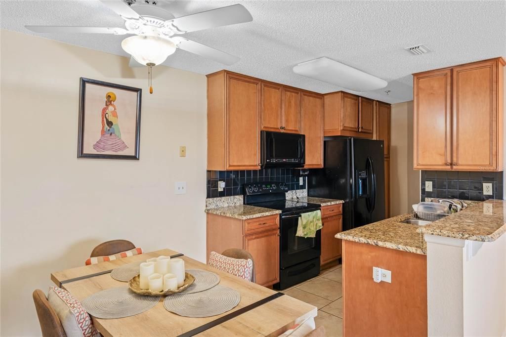 Dining area and kitchen with built-in cabinets for storage