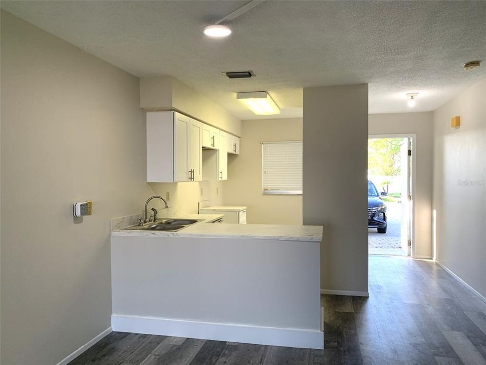 View of front door & Kitchen