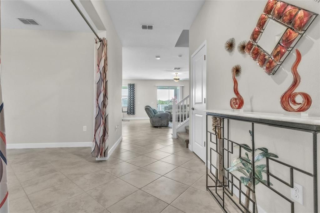 The Foyer welcomes you in with ceramic tile that seamlessly unites the lower level spaces.