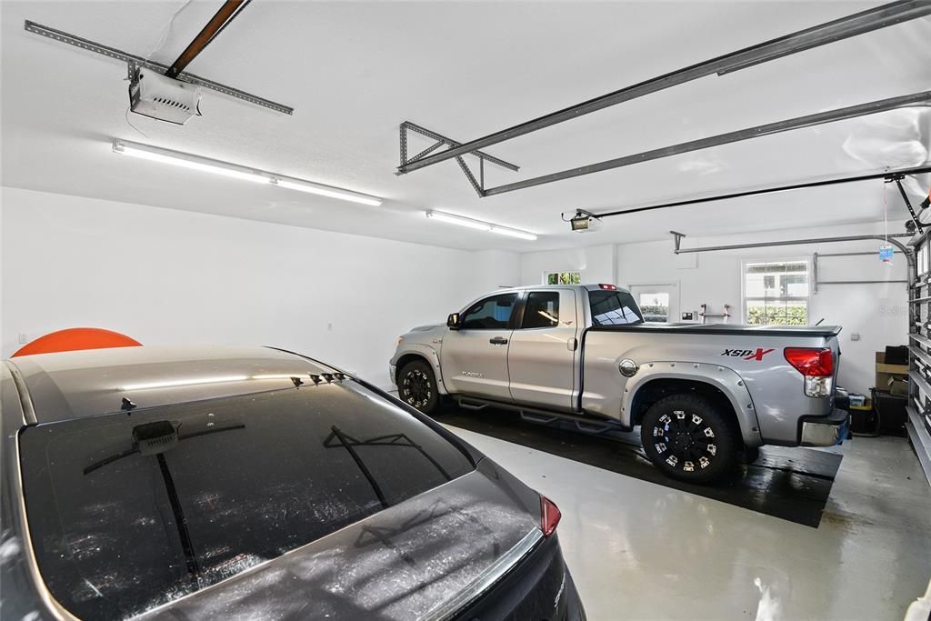 Interior of detached 3-car air conditioned garage w/ epoxy floors