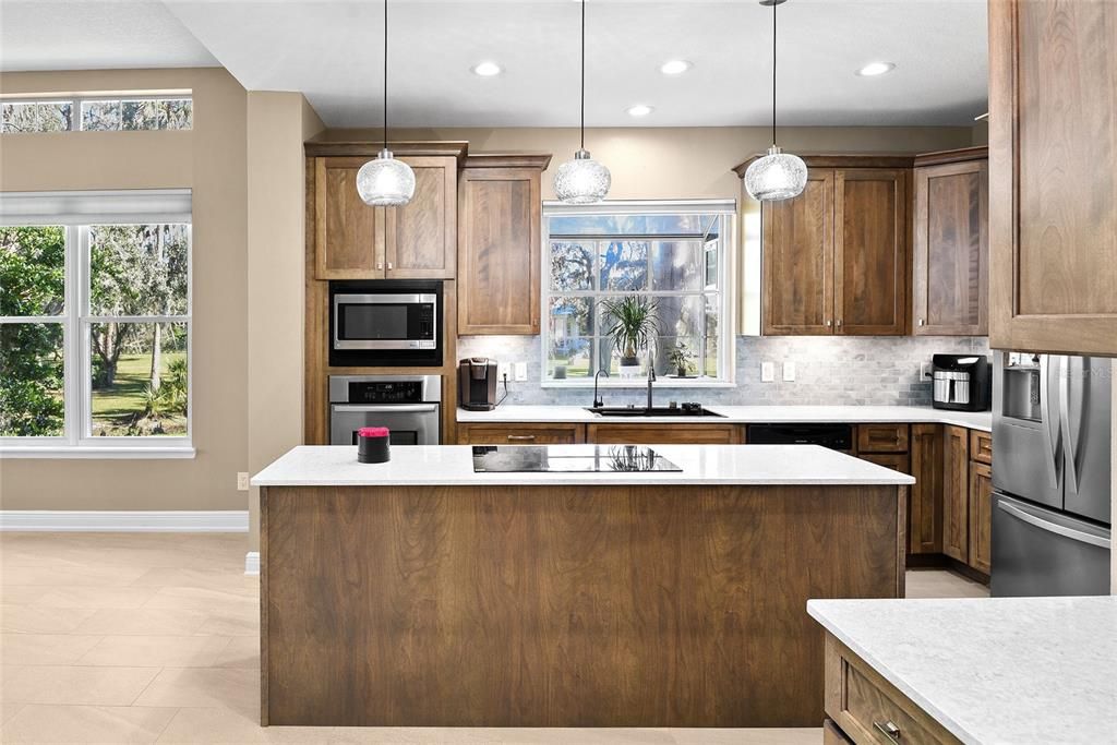 Modern center kitchen island w/ an abundance of natural light