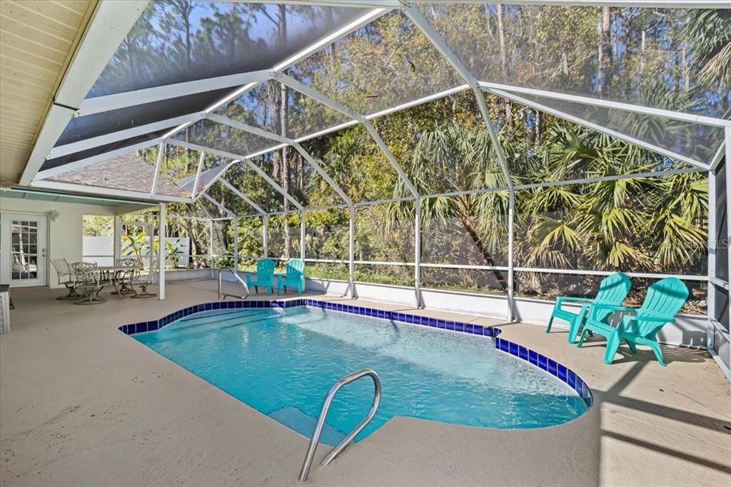 Fully enclosed lanai with heated inground pool area