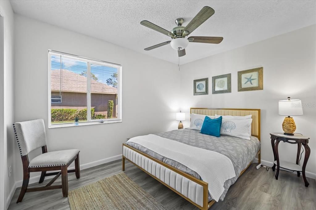 Bedroom primary with ceiling fan, walk in closet and full bath