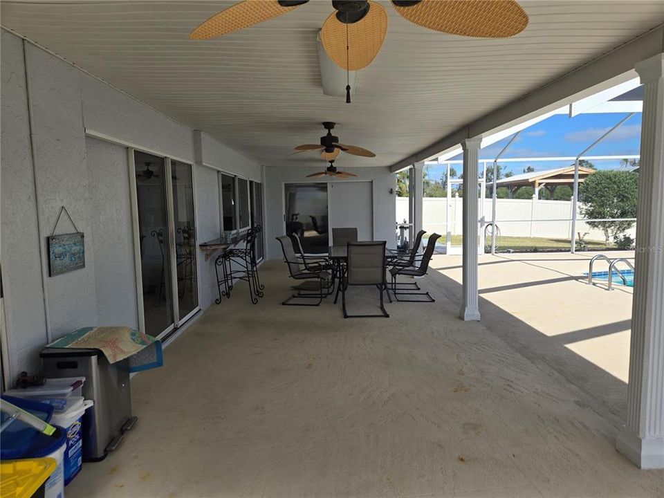 Large Lanai living space with TV wall !