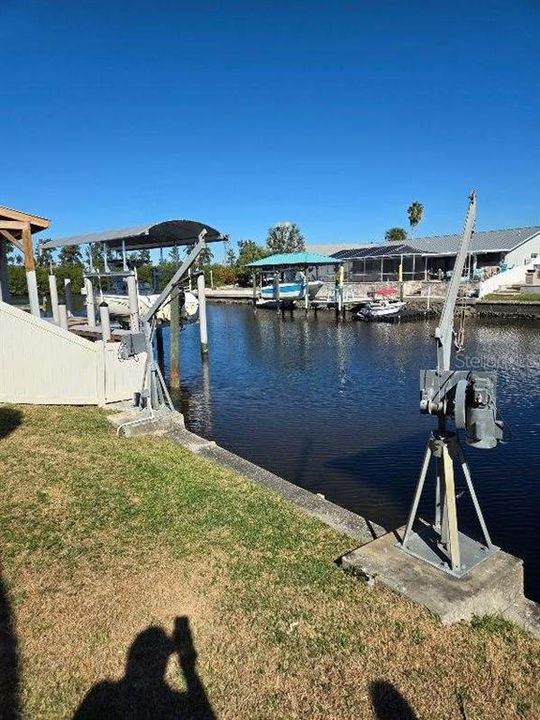 Sliders out to boat lifts and screen in pool and dinning / party area.