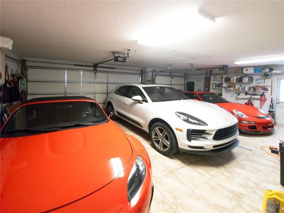 Tiled garage floor with electric screens