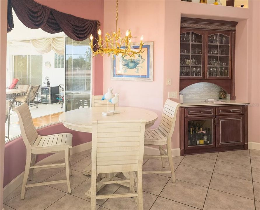 Breakfast nook with mitered window & pool views