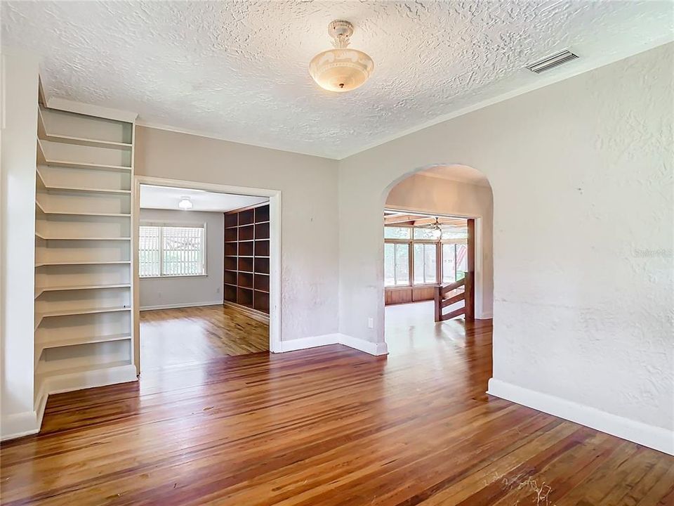 Living room and adjacent den/office.