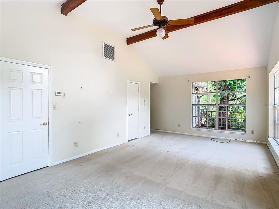 Primary bedroom with two walk-in closets.