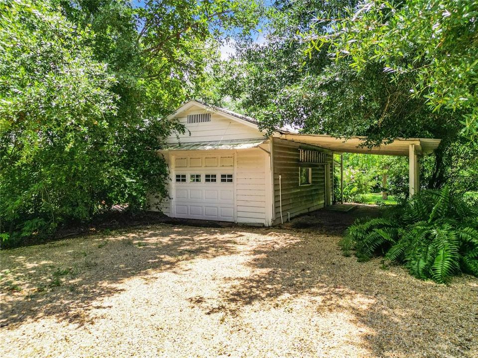 Detached single garage with carport