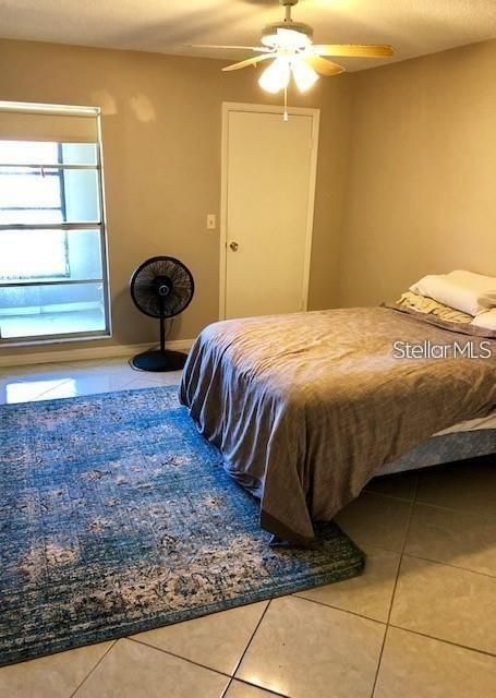 Primary bedroom with walk-in closet pictured in the back