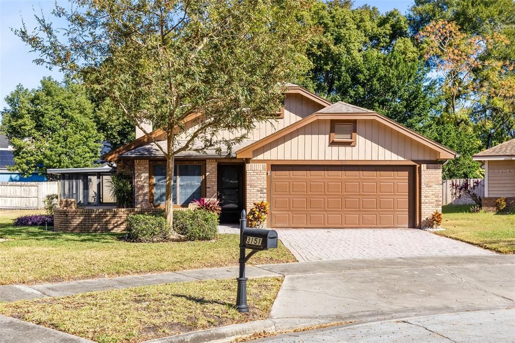 Curb appeal with pavers and brick facade