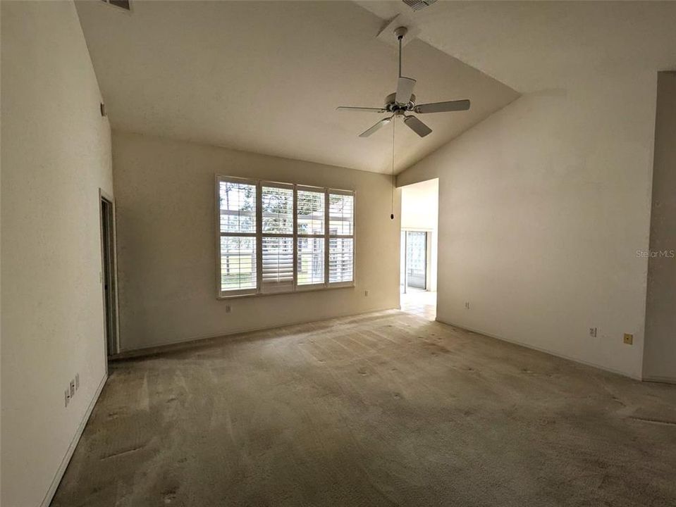 living room with vaulted ceilings and great view outside