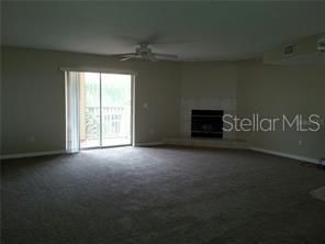 Living room with slider to screened porch