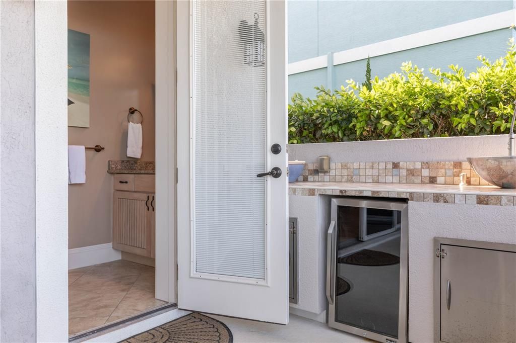 Outdoor bathroom by pool