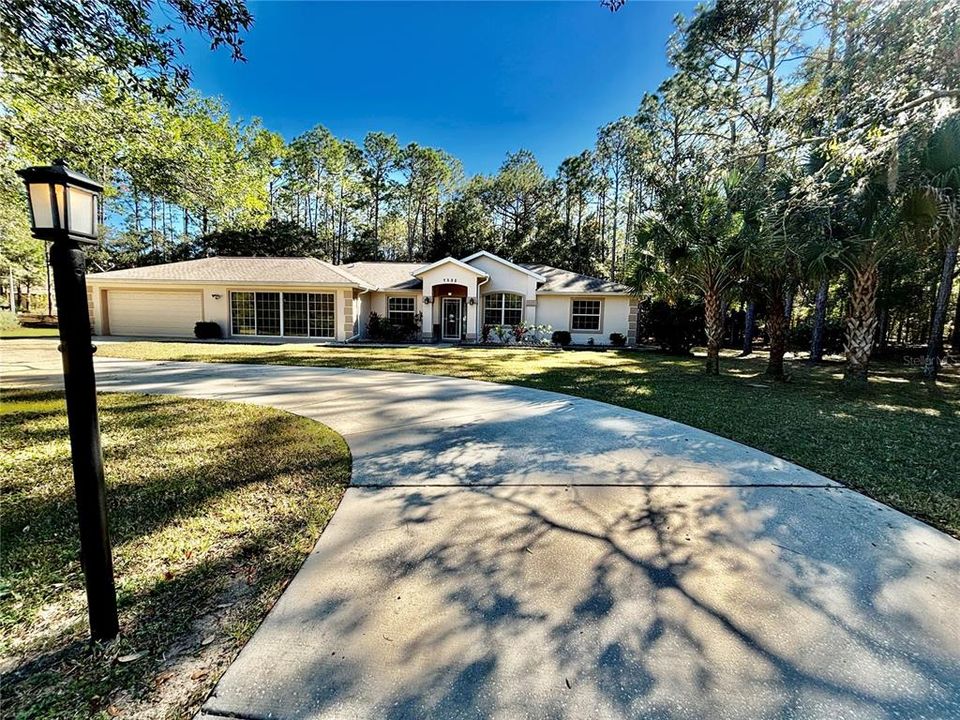 Front of home with circle driveway