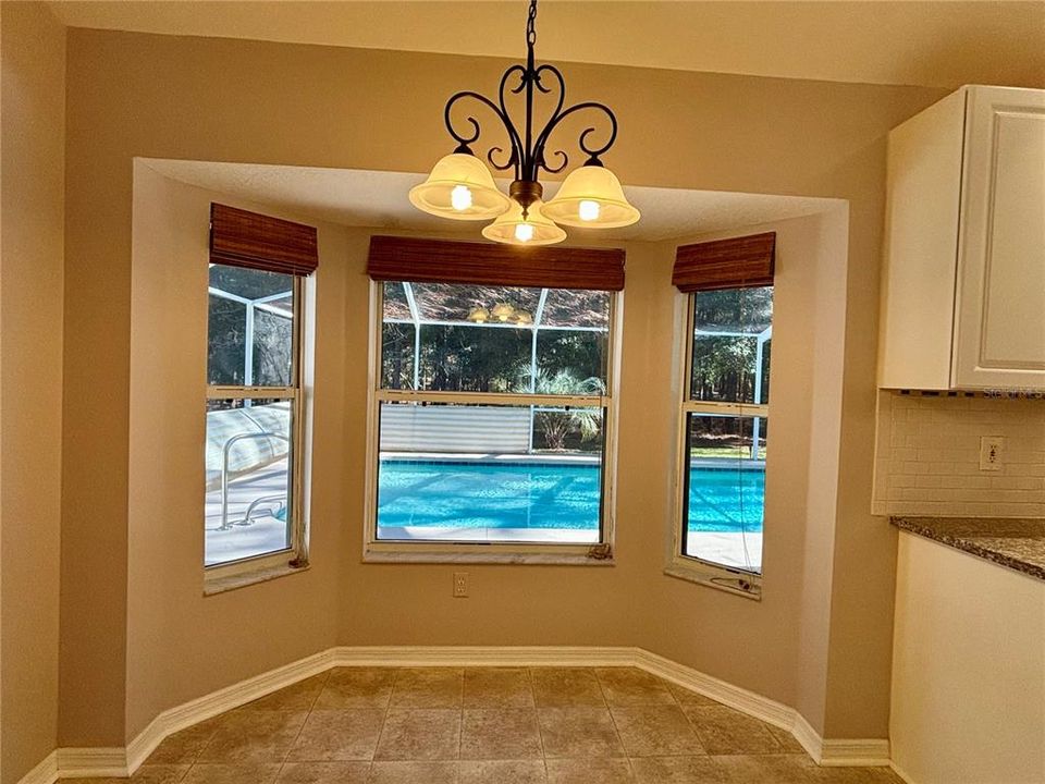 Kitchen nook looking out at pool area