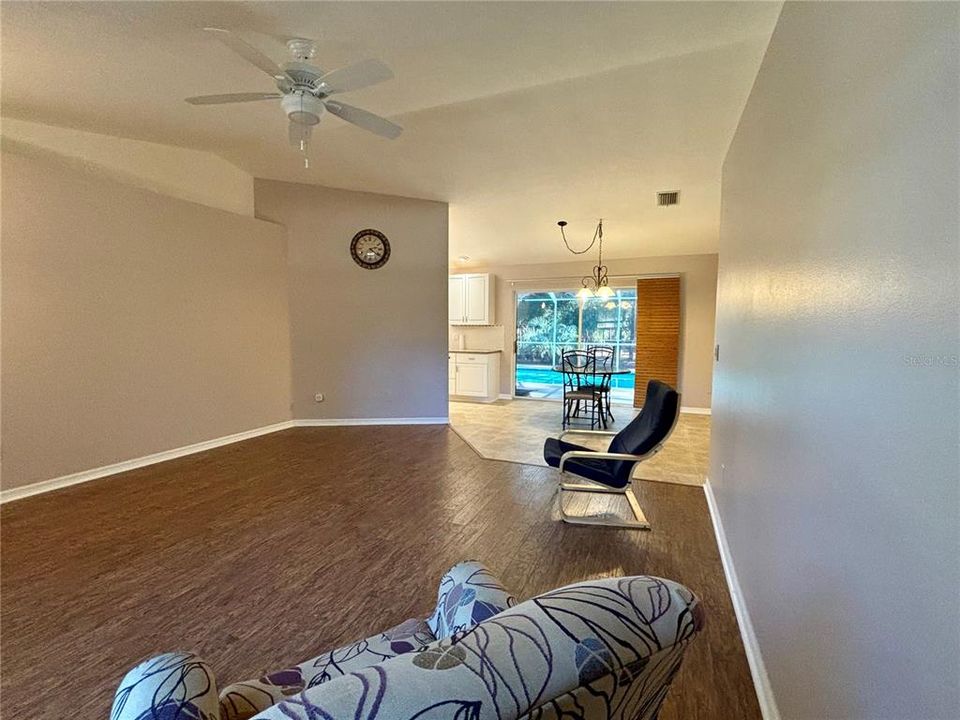 Living room looking towards dining room and pool view