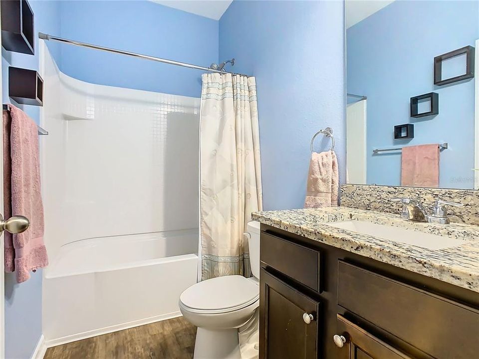 Guest bathroom has a tub shower combination