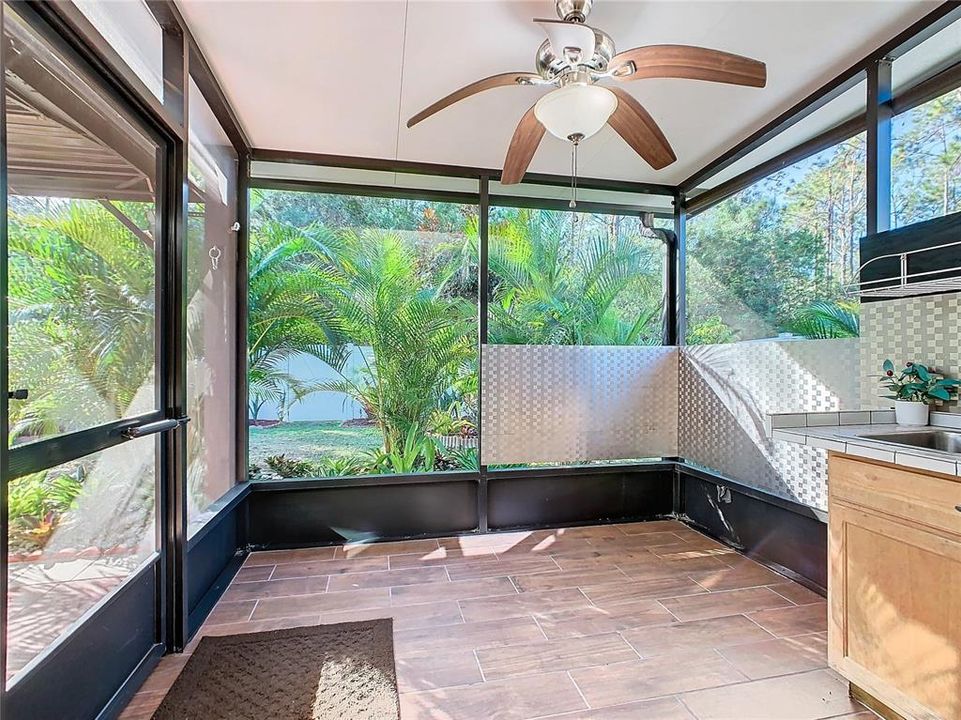 Screened patio is 10' x 10' with insulated patio roof and ceiling fan to allow you to enjoy your outside space.