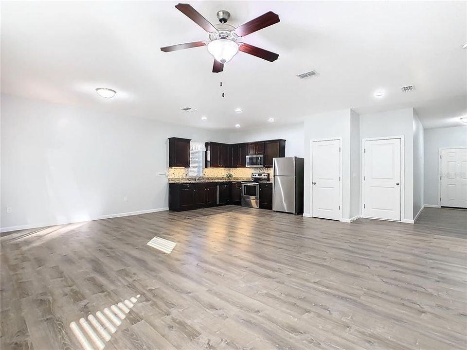 Open floor plan between the living room/dining room and kitchen.