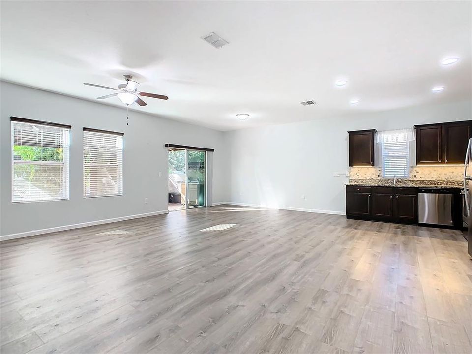 Large windows and sliding glass door at the back of the home allow plenty of natural light to filter into the home.