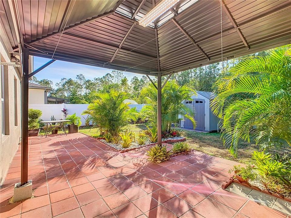 The gazebo provides addition space to sit outside and enjoy your back-yard retreat.