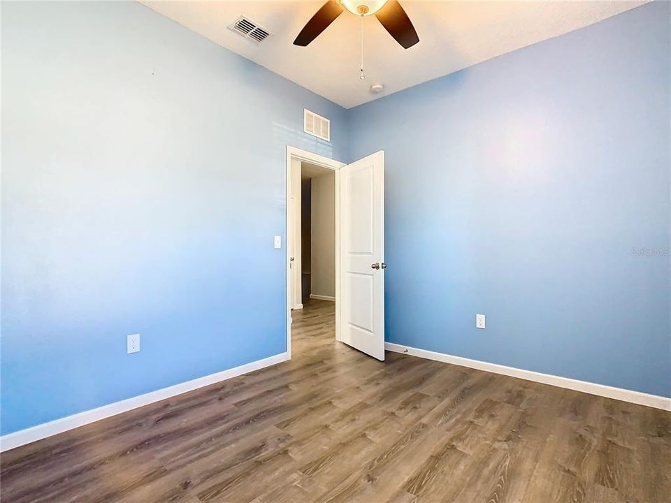 Bedroom 2 has new vinyl flooring.