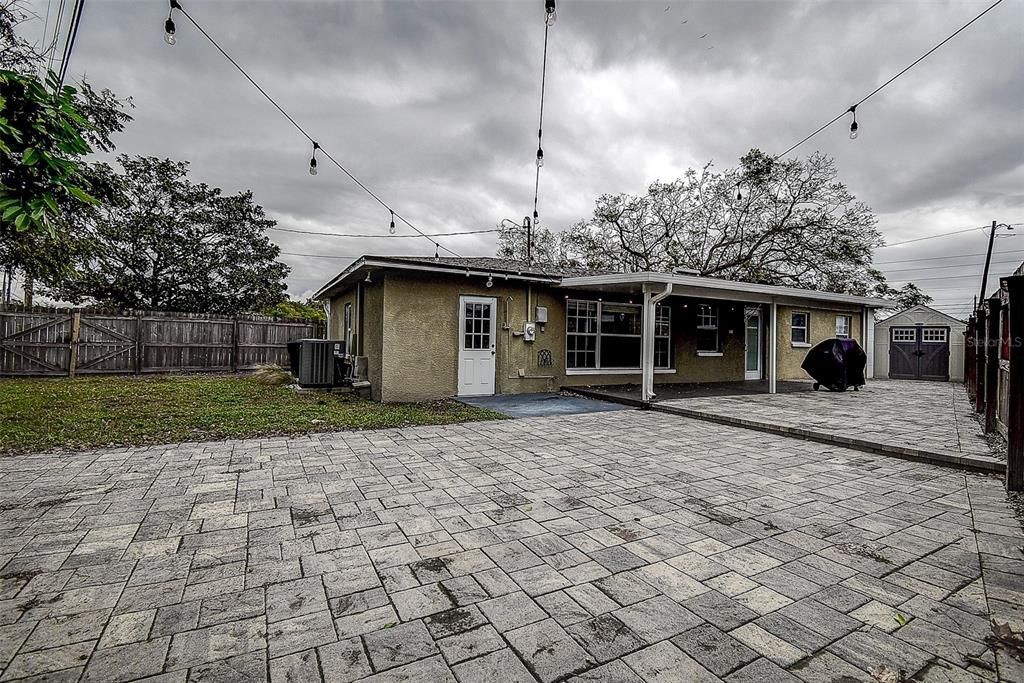 Pavers and grass area plus decorative outdoor lighting