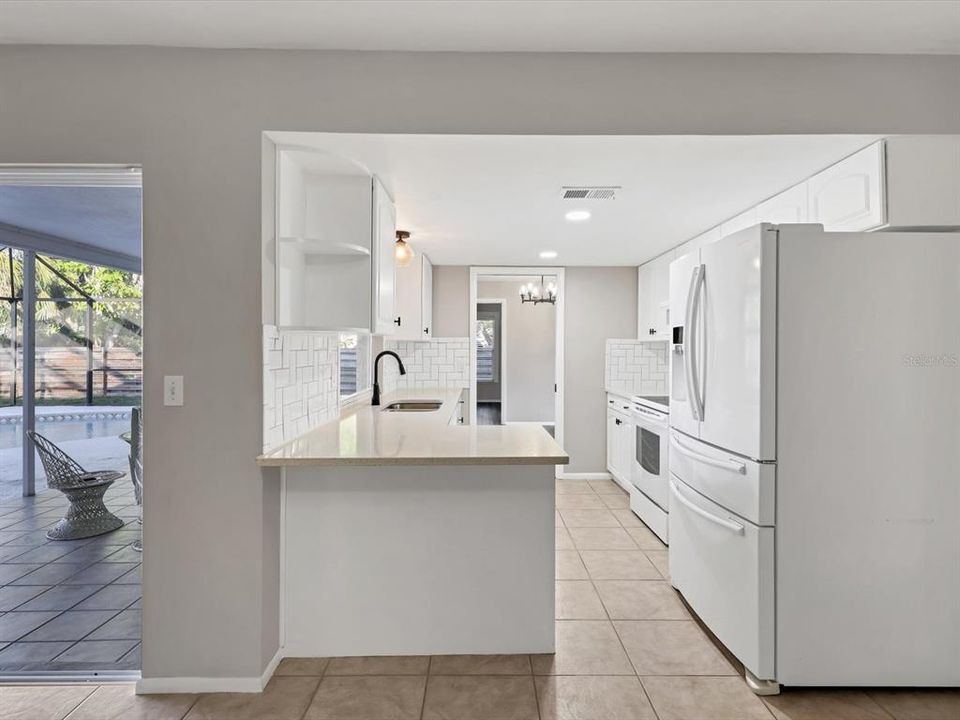 Kitchen flows into Family Room