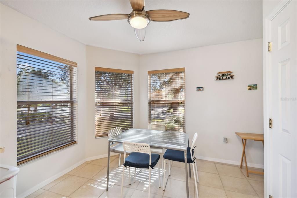 Kitchen seating area with 3 large windows