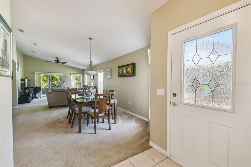 Entrance dining and living room to the right; kitchen to the left