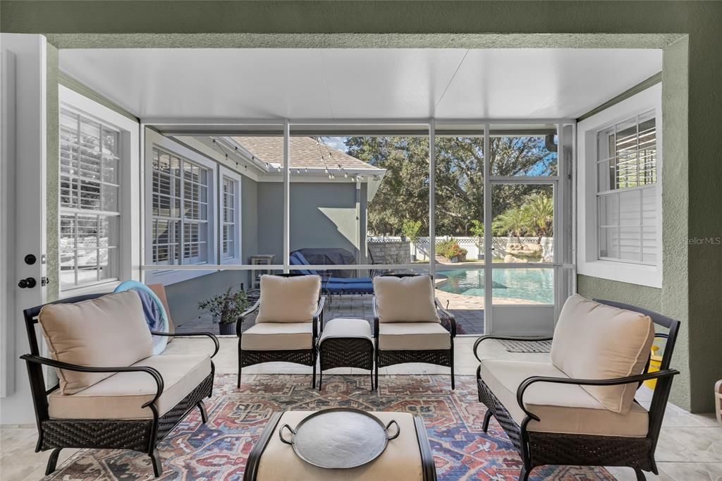 Keep an on the pool from the comfort of screened back porch!