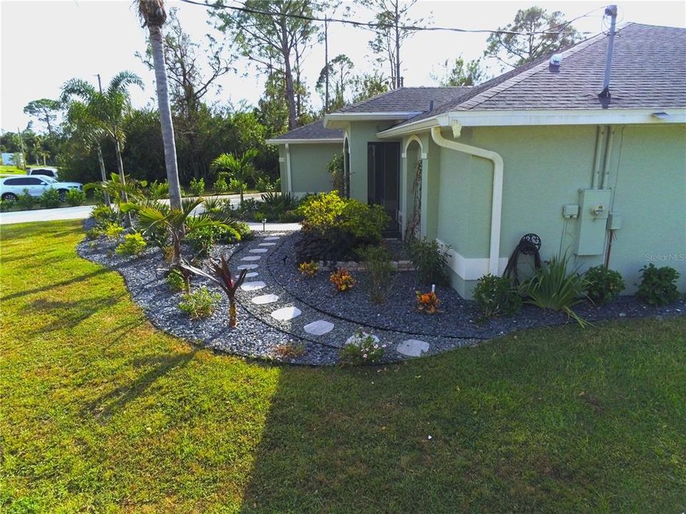 Pavers leading to side of home