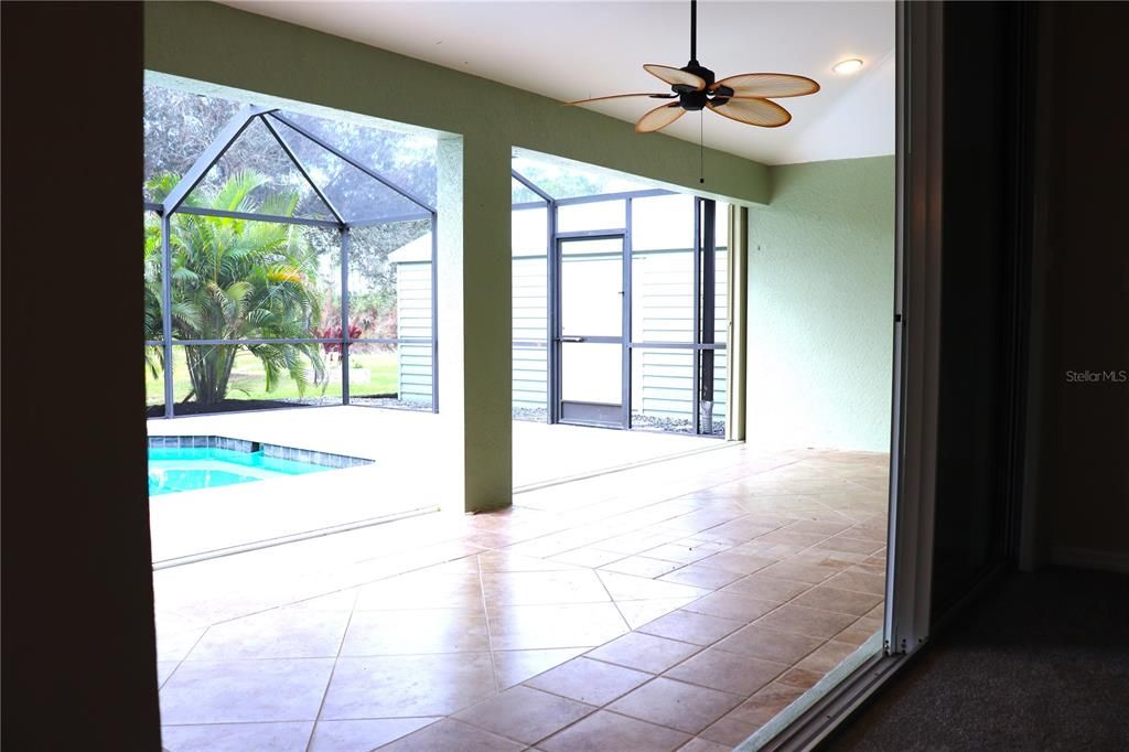 Patio with tile and ceiling fan