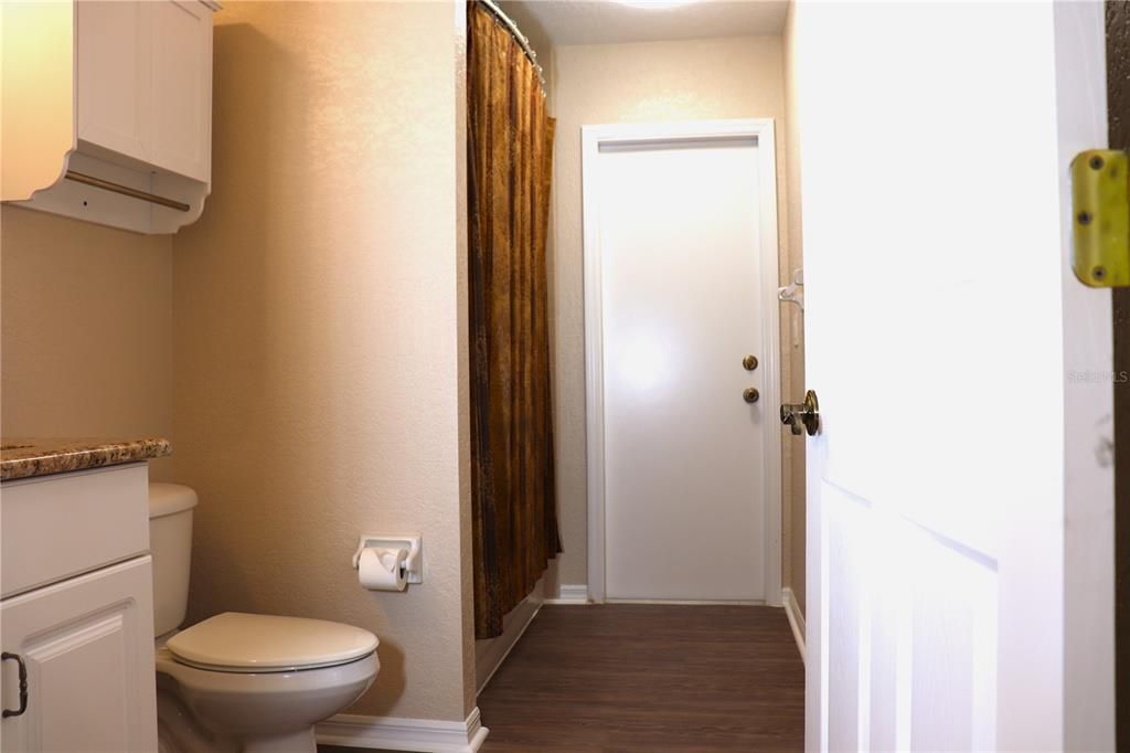 Guest Bathroom with access to pool area.