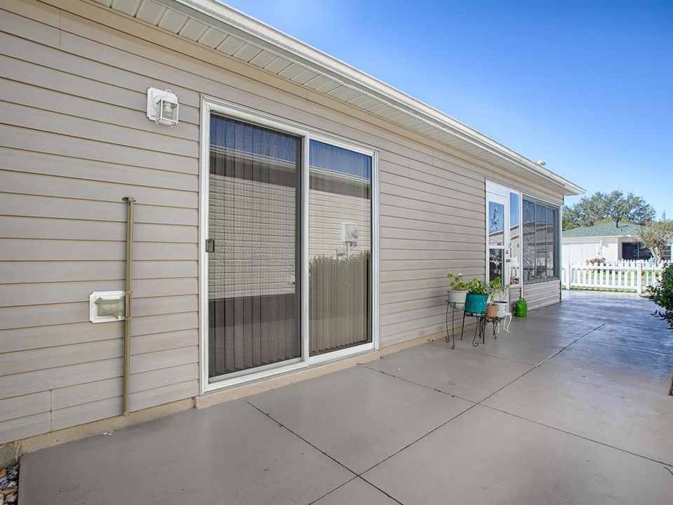 WRAP-AROUND SIDE PATIO HAS PLENTY OF SPACE FOR OUTDOOR FURNITURE -- PERFECT FOR GRILLING AND ENTERTAINING FRIENDS!