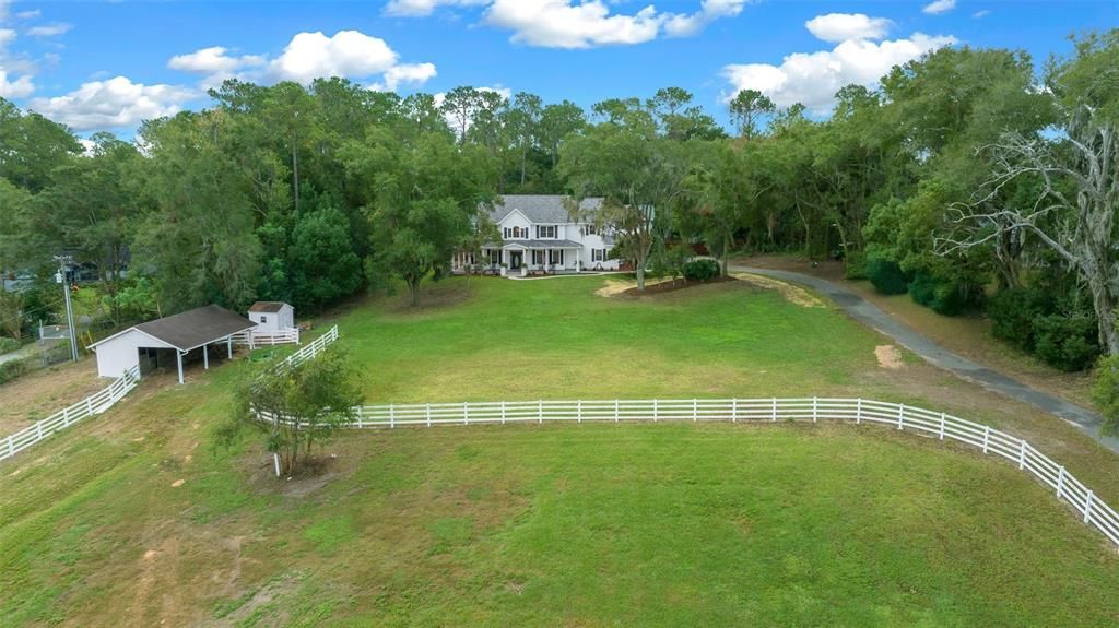 Front Aerial View Of Home, Paddock & Barn