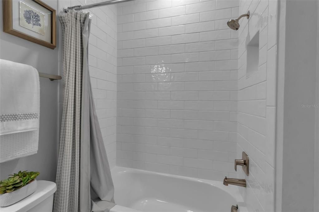 Tub with tile to the ceiling