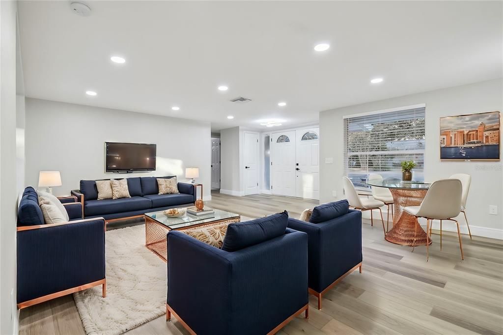 Living room open to kitchen and dining area