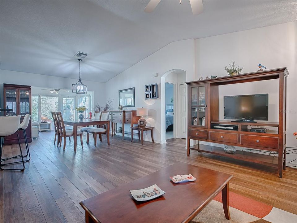 THE HIGH, VAULTED CEILING AND ARCHED DOORWAYS JUST ADD TO THE BEAUTY OF THIS SPACE!