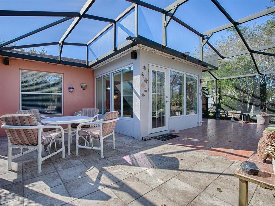 STEP OUTSIDE TO THE PATIO -- UNDER A HUGE BIRDCAGE WITH PLENTY OF ROOM FOR ENTERTAINING FRIENDS AND FAMILY!