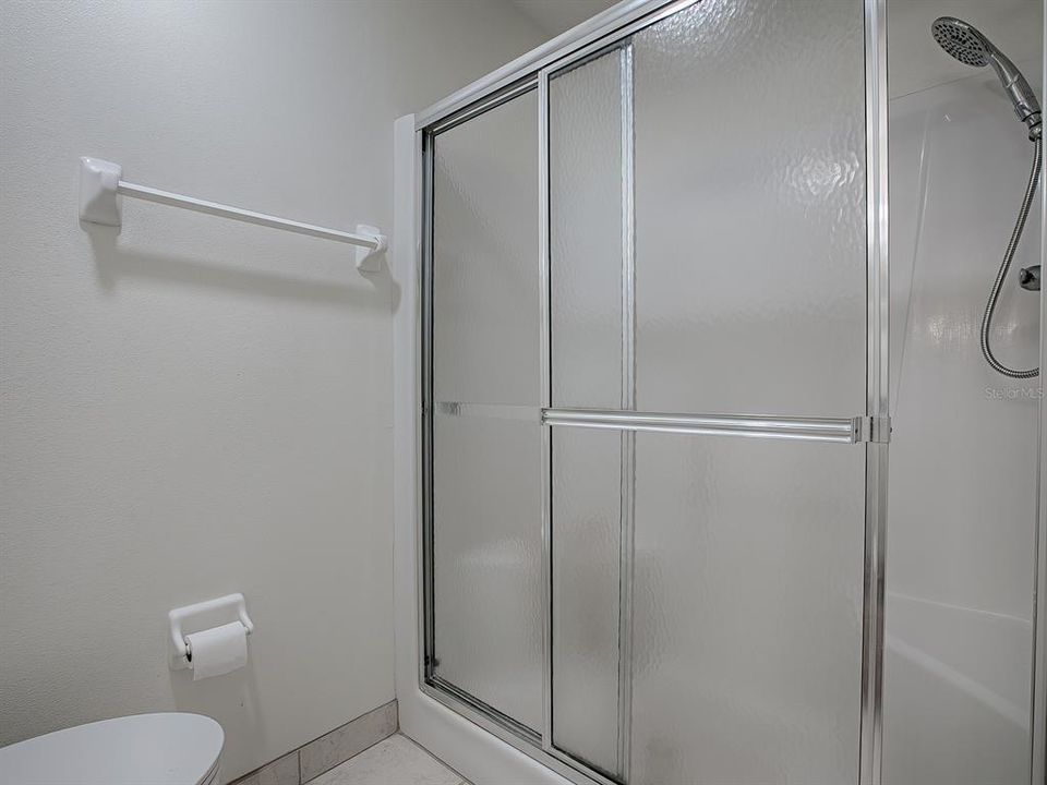 SEPARATE TOILET ROOM AND SPACIOUS WALK-IN SHOWER