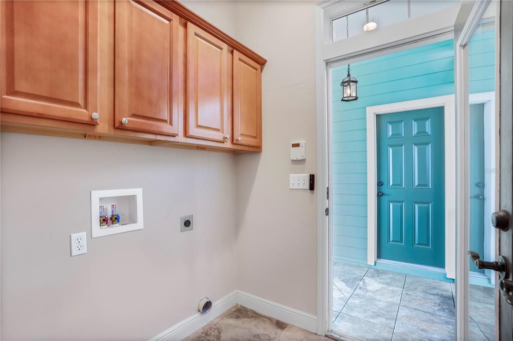 In-home laundry room, leads you from the kitchen to the screened lanai